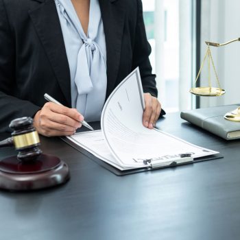 female-lawyer-working-with-legal-case-document-contract-office-law-justice-attorney-lawsuit-concept Birleşmeler/Devralmalar