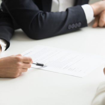 negotiations-about-contract-terms-concept-hand-pointing-document-closeup Kişisel Verilerin Korunması